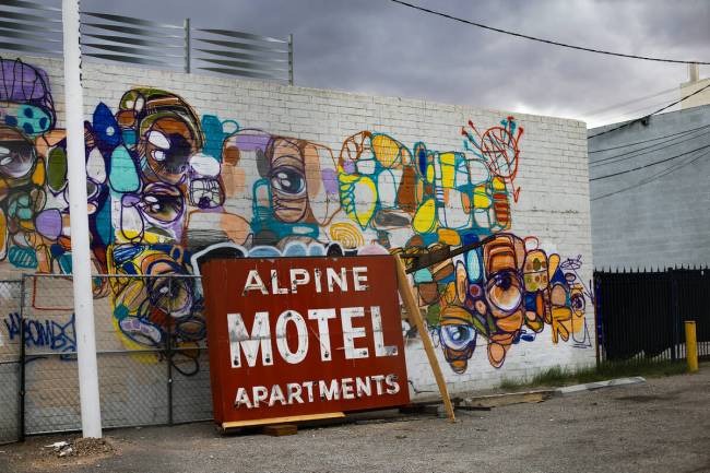 The sign of the Alpine Motel was removed and sits in the lot adjacent to the building on Dec. 9 ...
