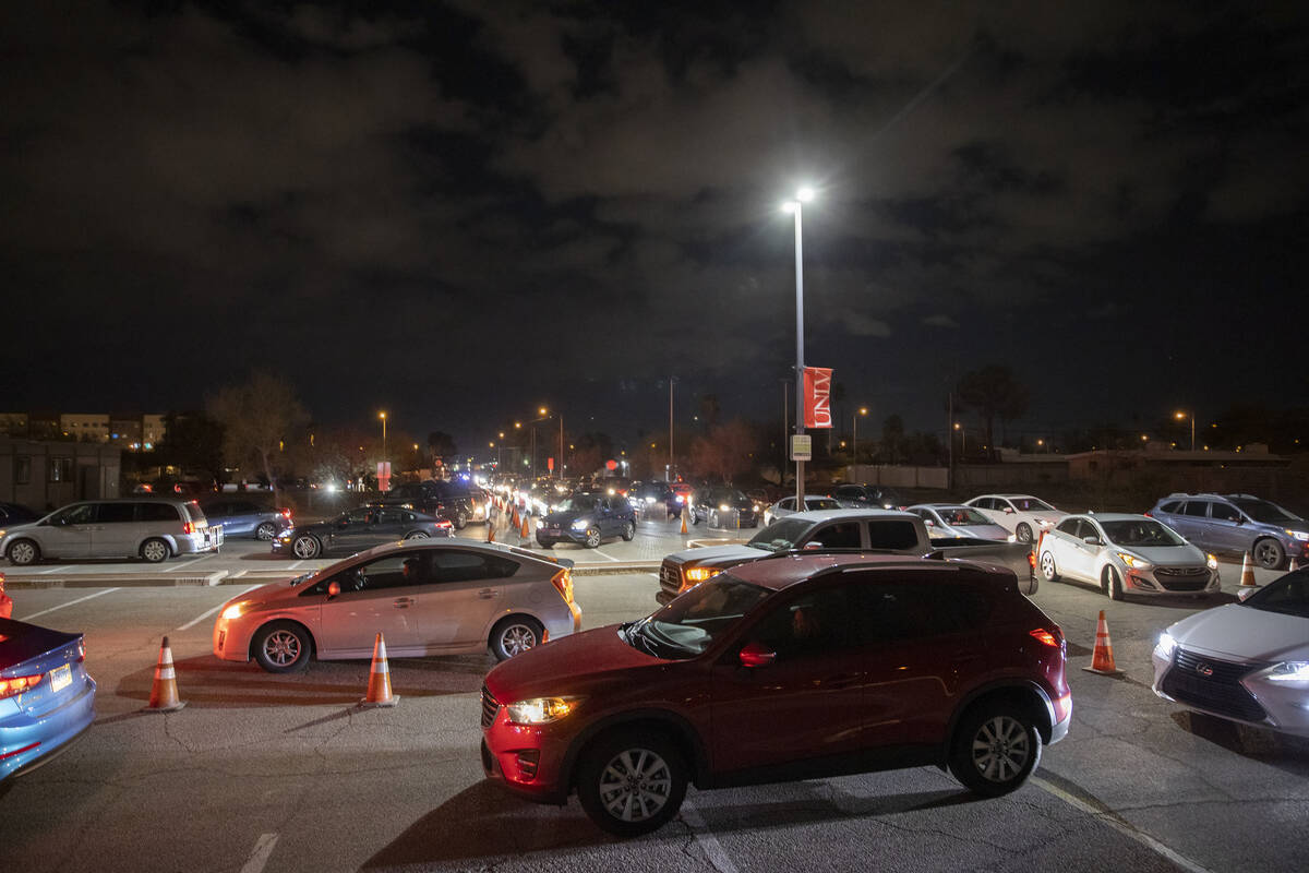 Traffic is backed up for blocks at a drive-thru and walk-up COVID-19 testing site at UNLV Parad ...