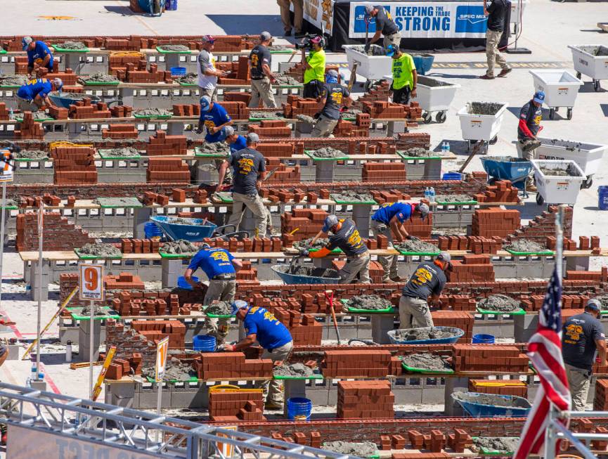 Competitors work their bricks and mortar in the Spec Mix Bricklayer 500 during World of Concret ...