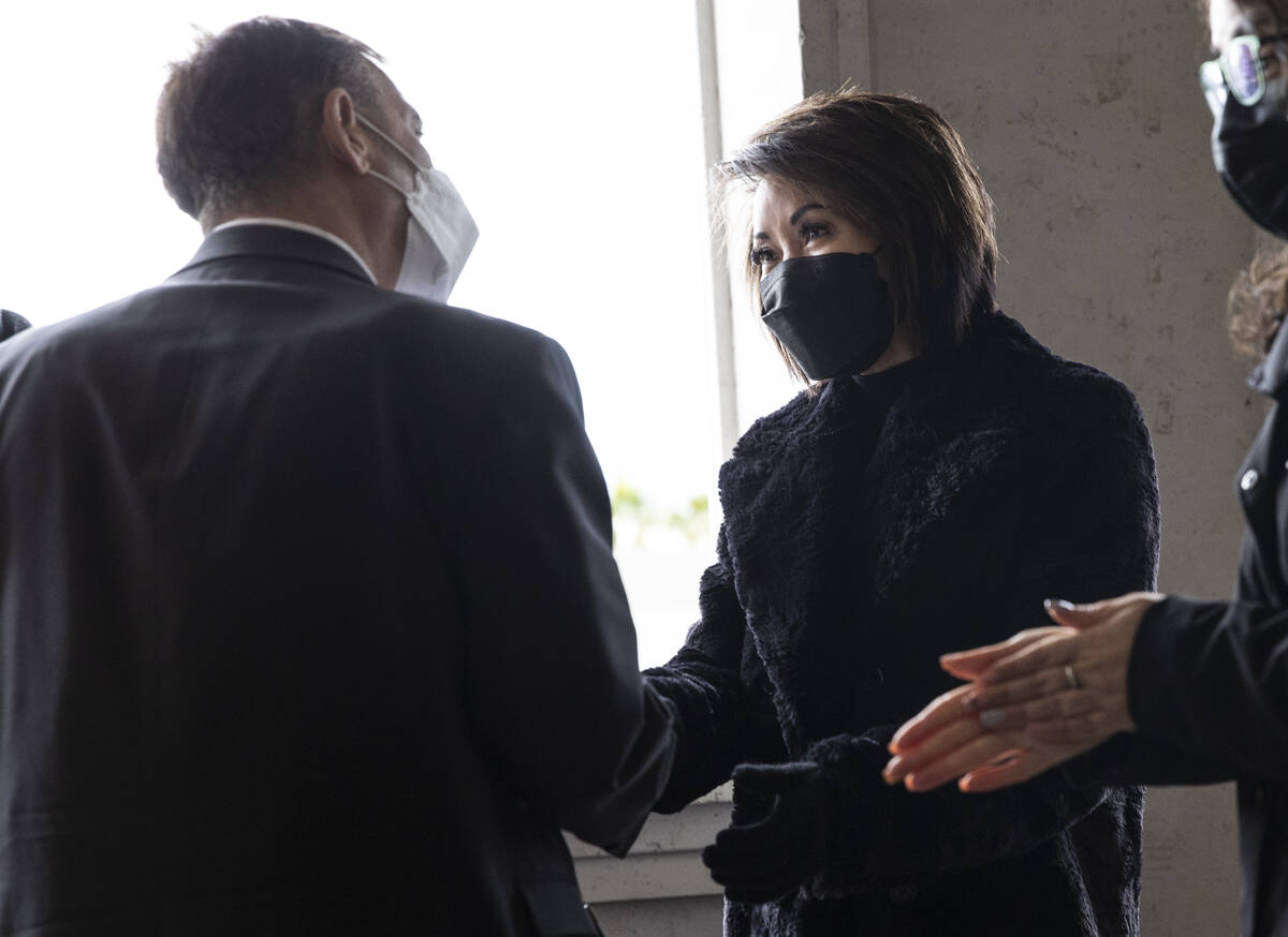 First Lady Kathy Sisolak greets Joe Muscaglione, managing partner at ShangHai Taste, where a wa ...