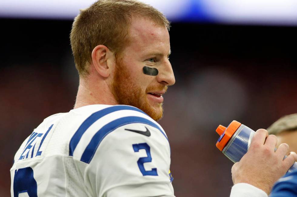 Indianapolis Colts quarterback Carson Wentz (2) waits for play to resume during an NFL football ...