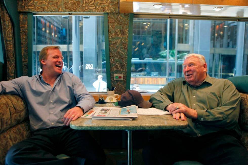 NFL commissioner Roger Goodell, left, and Pro Football Hall of Fame coach John Madden leave th ...