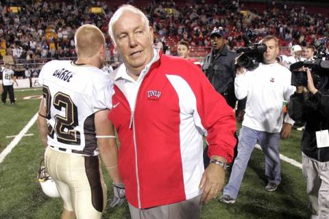 John Robinson walks off the field after his final home game as UNLV head coach, a triple-overti ...