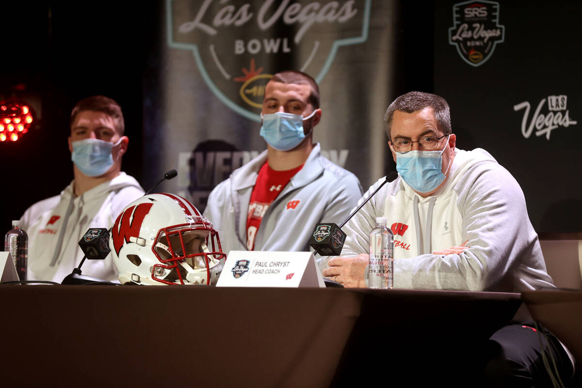 Wisconsin linebacker Jack Sanborn, from left, tight end Jake Ferguson and Paul Chryst during a ...