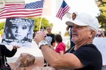Jay Harrison of Las Vegas protests against the Nevada System of Higher Education's vaccine mand ...