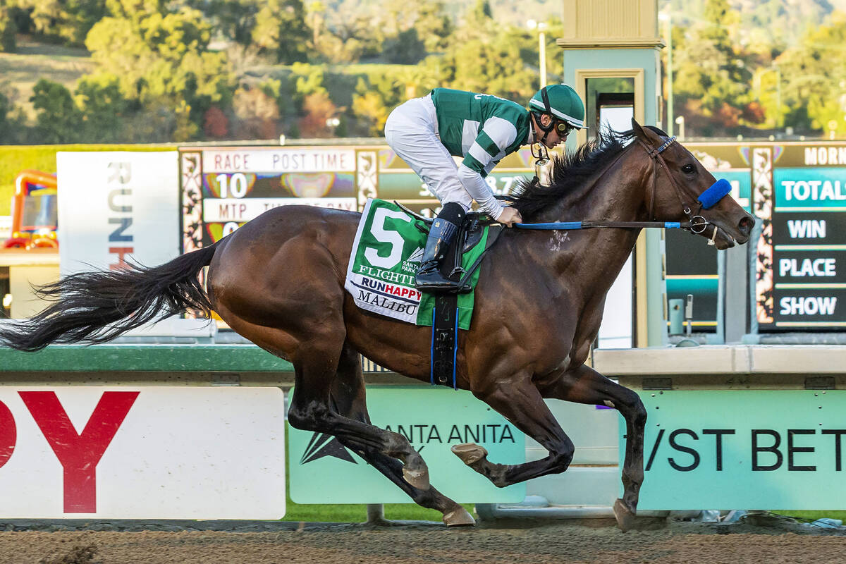 In this image provided by Benoit Photo, Flightline, with Flavien Prat aboard, wins the Grade I, ...
