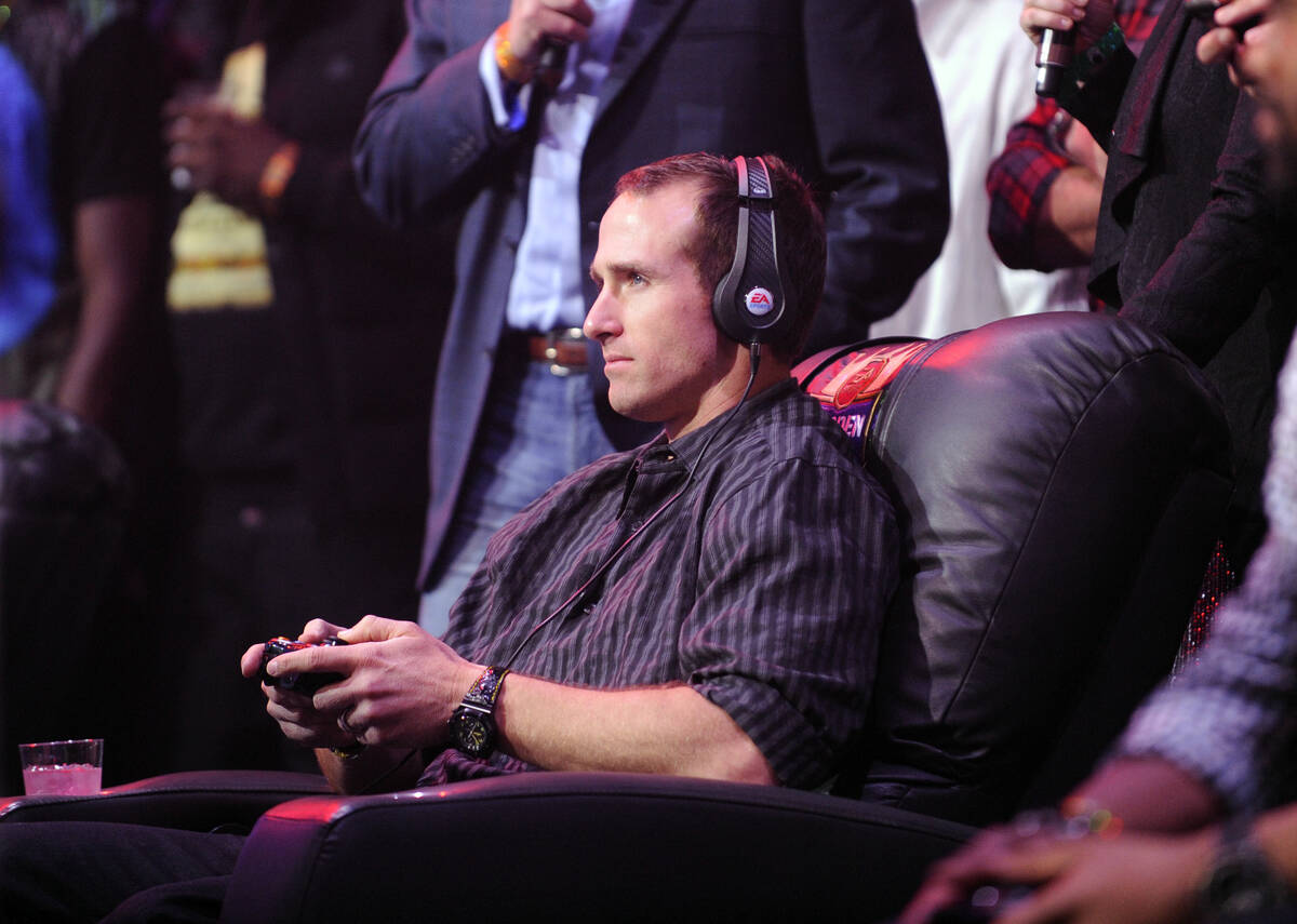 New Orleans Saints quarterback Drew Brees plays Madden at the EA SPORTS Madden Bowl XIX Party o ...