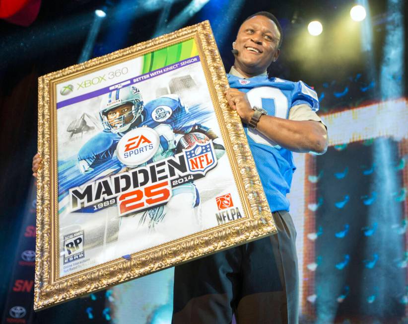 IMAGE DISTRIBUTED FOR EA SPORTS - NFL hall of fame running back Barry Sanders holds up a mock u ...