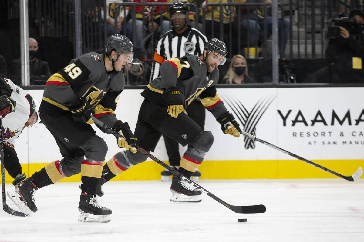 Golden Knights defenseman Peter DiLiberatore (49) and defenseman Alex Pietrangelo (7) skate tow ...