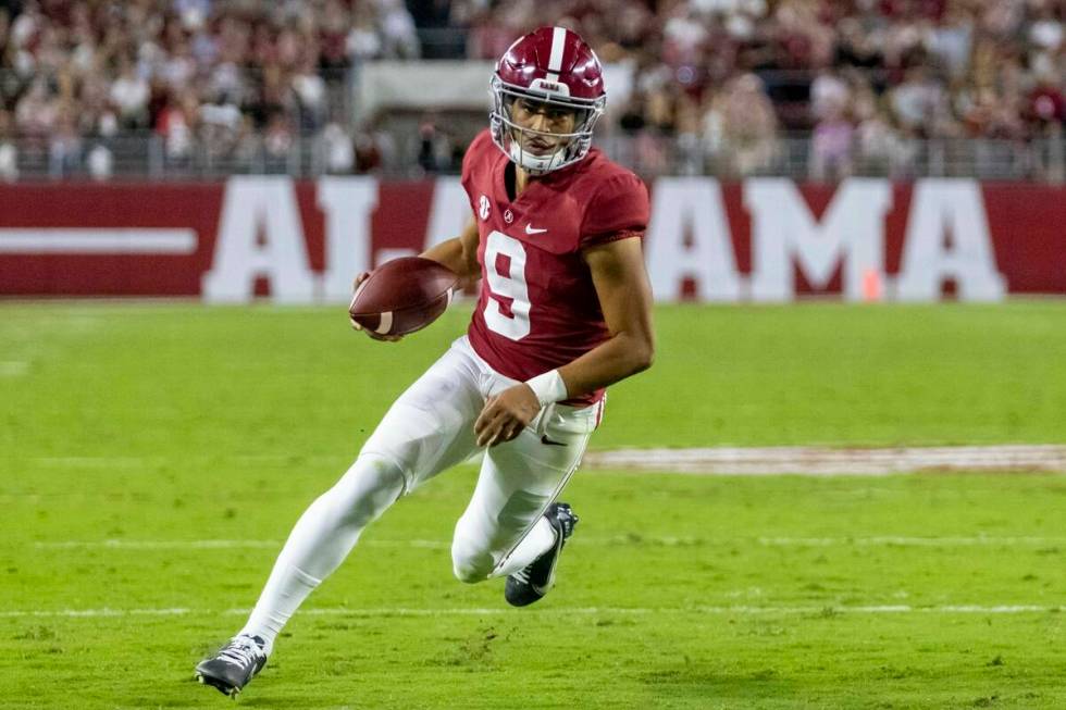 Alabama quarterback Bryce Young runs the ball against Tennessee during the first half of an NCA ...