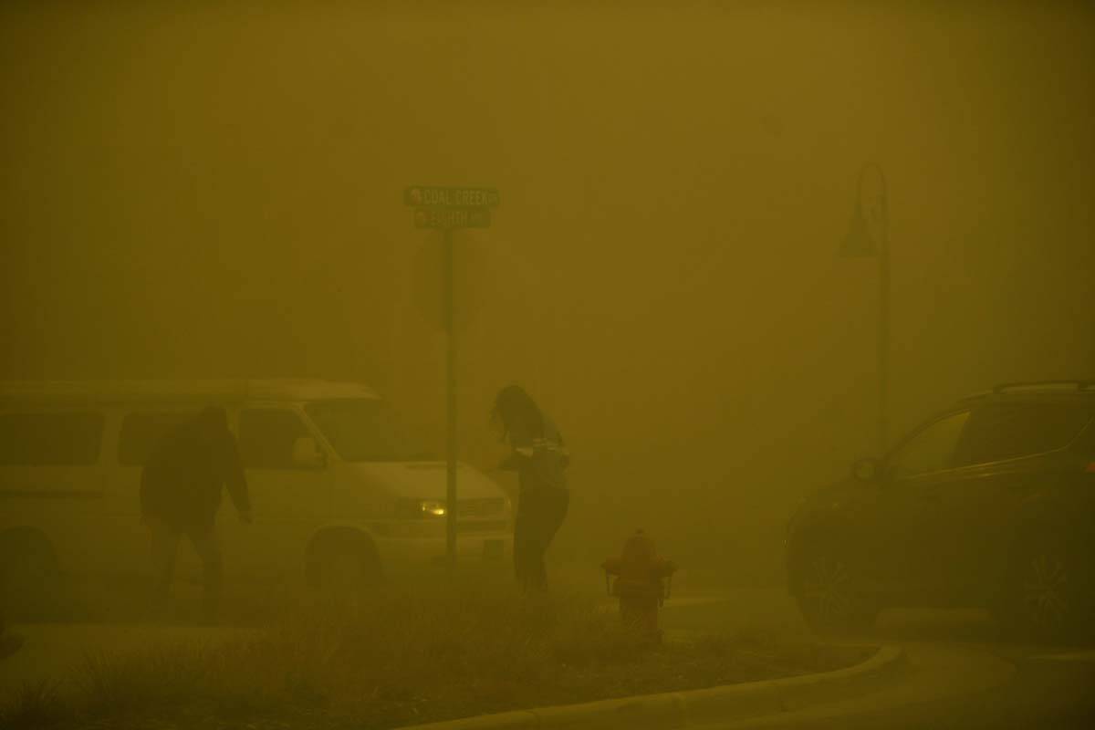 Smoke from nearby fires obscures visibility, Thursday, Dec. 30, 2021, in Superior, Colo. An est ...
