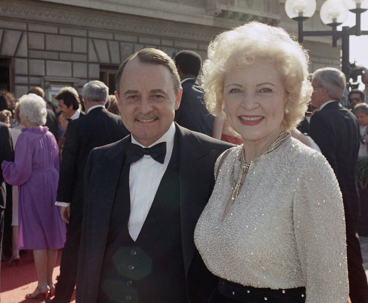 Actress Betty White with actor John Hillerman arriving at Emmy Awards, Sept. 22, 1985 in Pasade ...
