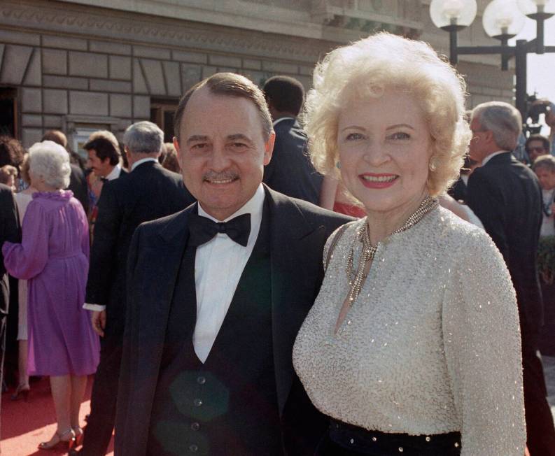 Actress Betty White with actor John Hillerman arriving at Emmy Awards, Sept. 22, 1985 in Pasade ...