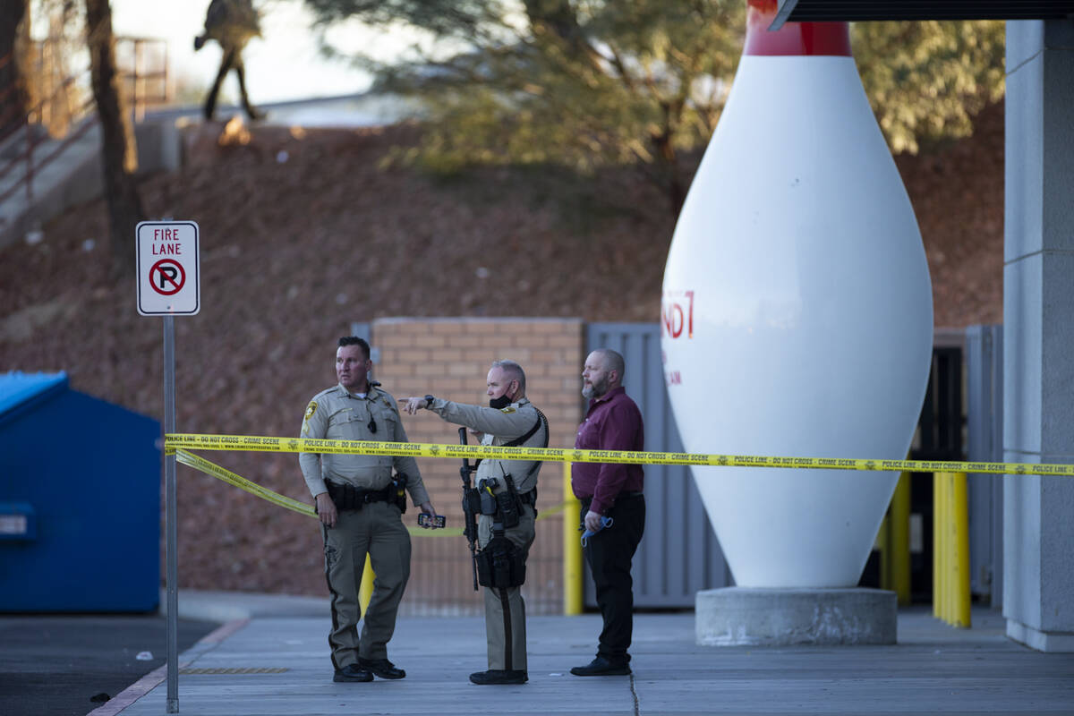 Las Vegas police officers investigate the scene of a shooting at Meadows Mall in Las Vegas, Fri ...