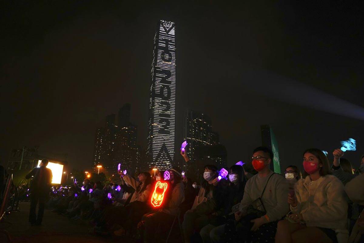 People celebrate during a New Year's Eve concert in Hong Kong Saturday, Jan. 1, 2022. (AP Photo ...