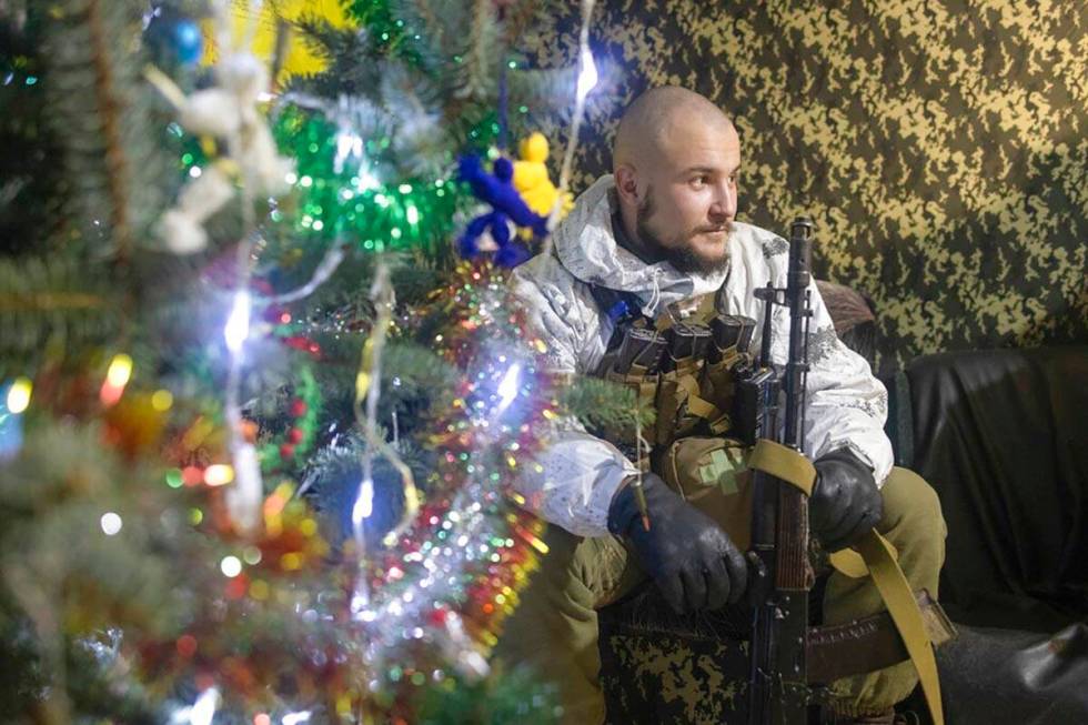 A Ukrainian soldier take a rest near a fighting position on the line of separation from pro-Rus ...