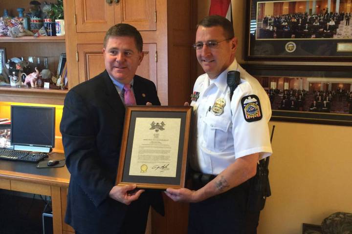 Former police officer Scott Clinger, at right, and his partner, Larry Geis won awards for helpi ...