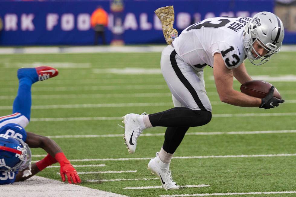 Las Vegas Raiders wide receiver Hunter Renfrow (13) makes a tight rope catch and run past New Y ...