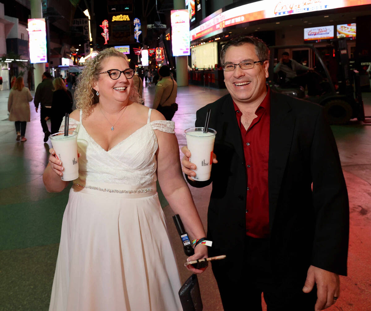 Newlyweds Stephanie and David Kereluk of Grayling, Mich., join the New Year's Eve party at the ...