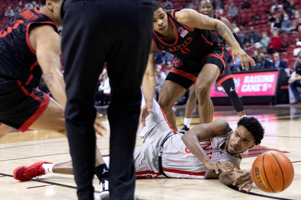UNLV Rebels guard Bryce Hamilton (13) passes from the court while San Diego State Aztecs guard ...