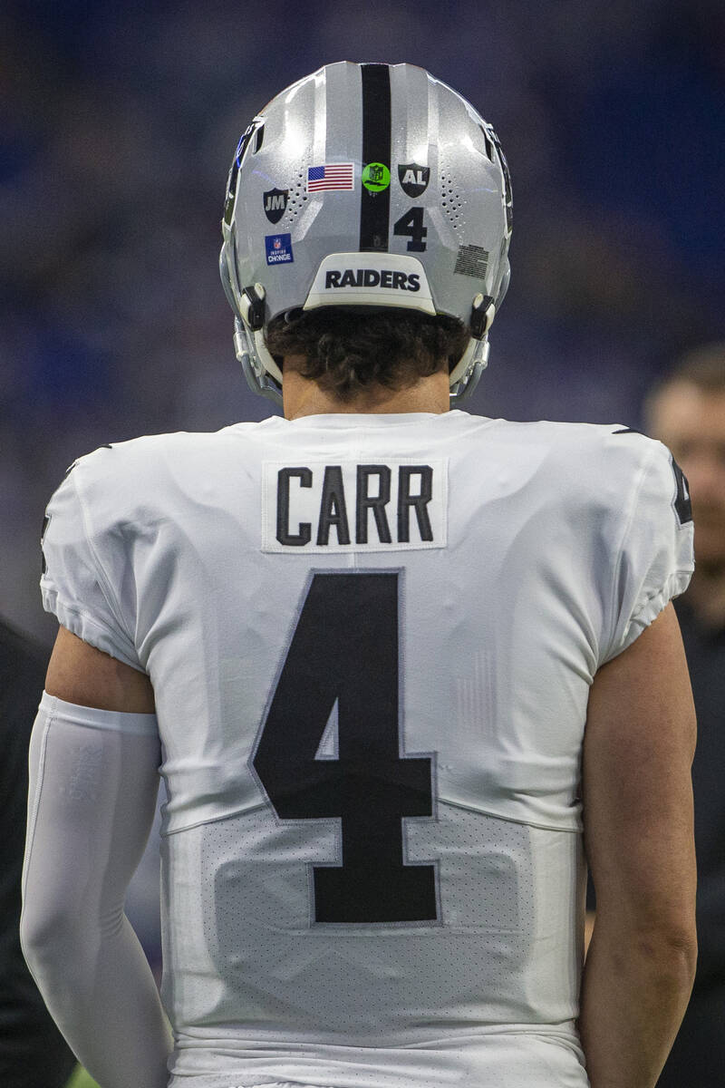 Raiders quarterback Derek Carr’s (4) helmet shows the addition of the initials ‘J ...