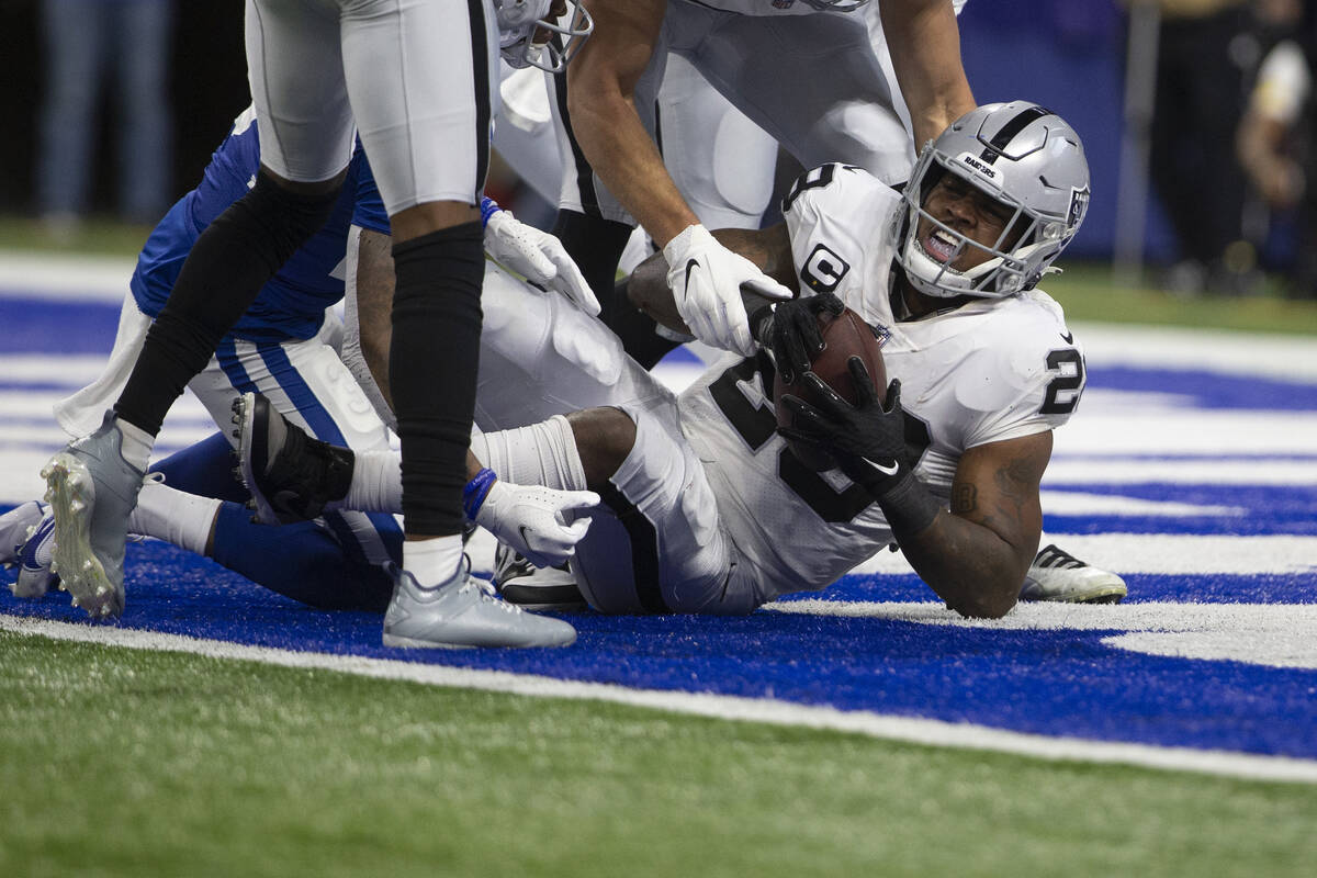 Raiders running back Josh Jacobs (28) scores a touchdown against Indianapolis Colts cornerback ...