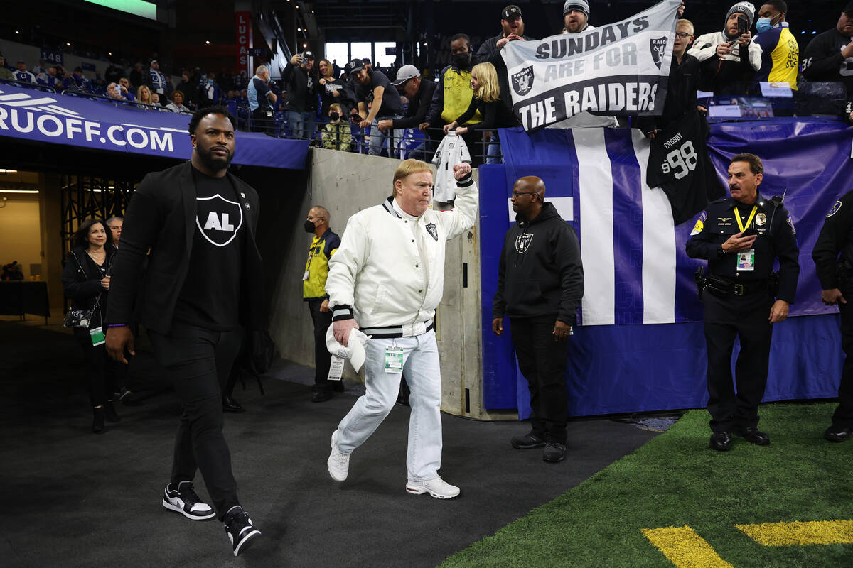 Raiders owner Mark Davis takes the field before the start of an NFL football game against the I ...