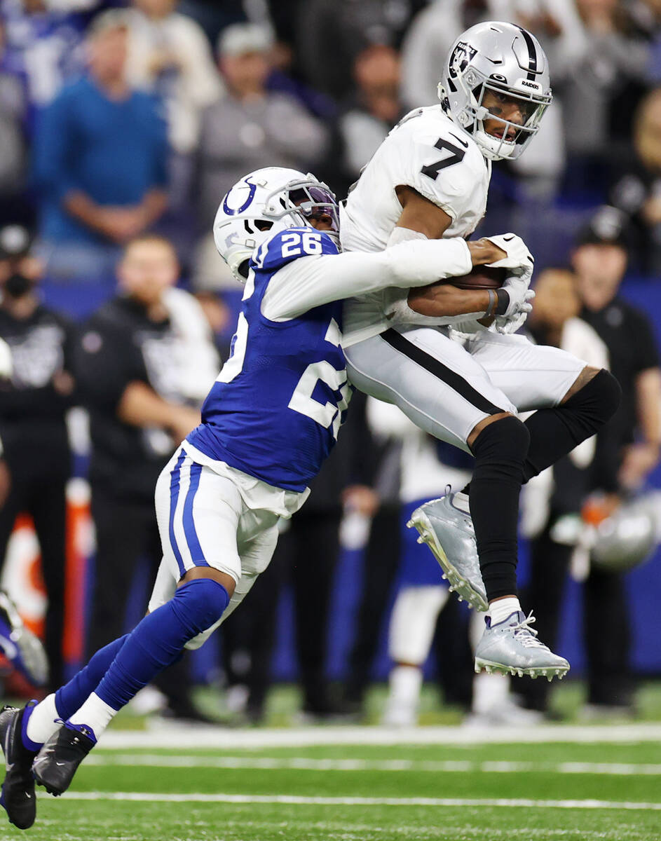Raiders wide receiver Zay Jones (7) makes a catch as he is tackled by Indianapolis Colts corner ...