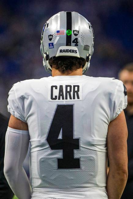 Raiders quarterback Derek Carr’s (4) helmet shows the addition of the initials ‘J ...