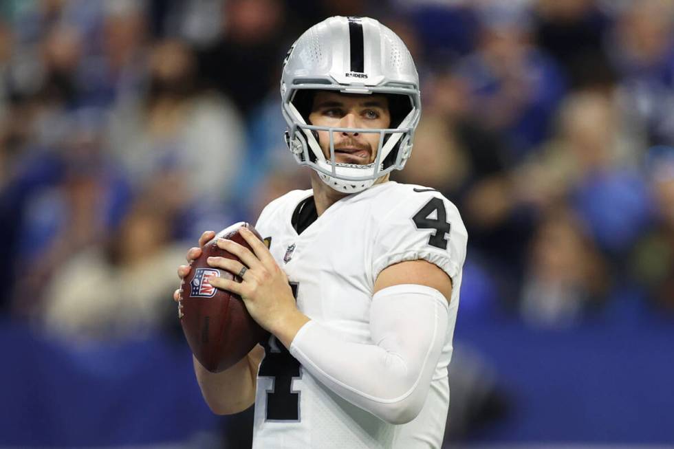 Raiders quarterback Derek Carr (4) looks for an open pass against the Indianapolis Colts in the ...