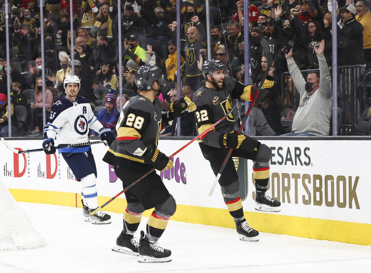 Golden Knights center Michael Amadio, right, celebrates his goal against the Winnipeg Jets duri ...