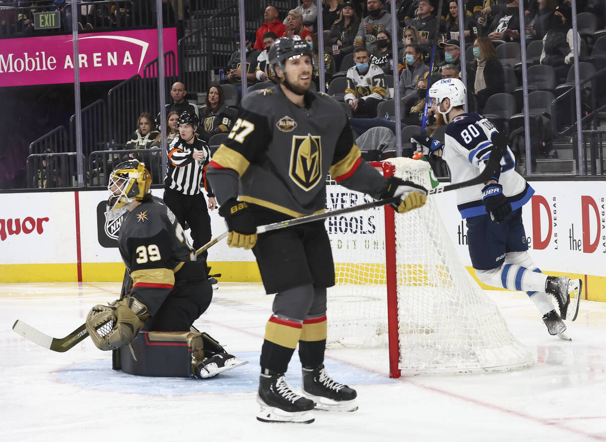 Golden Knights goaltender Laurent Brossoit (39) gives up a goal to the Winnipeg Jets as Golden ...