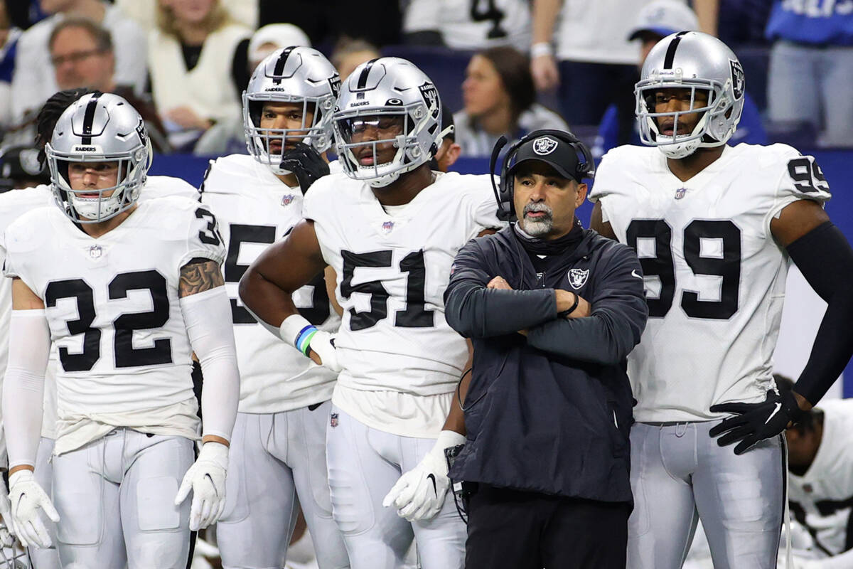 Raiders interim head coach Rich Bisaccia watches his team from the sideline in the second half ...