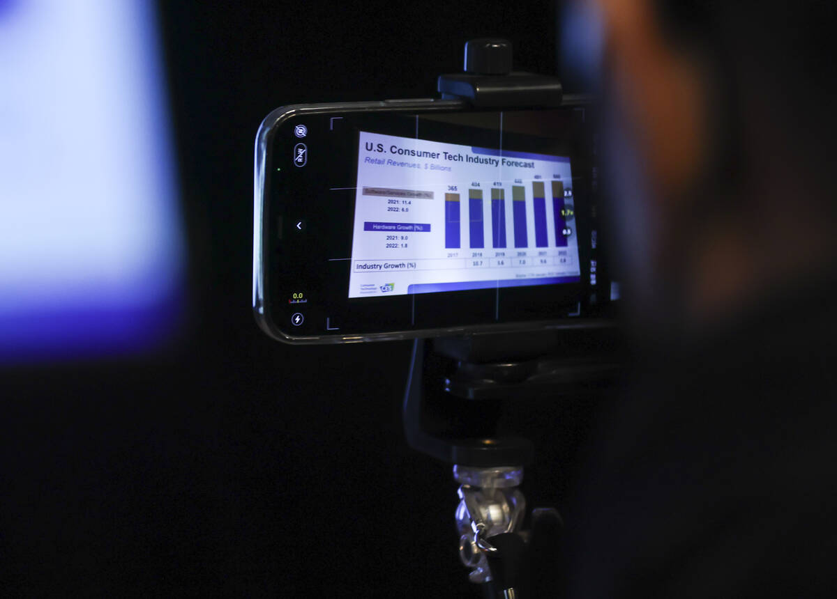 An attendee records during the "Tech Trends to Watch" session at CES media days at th ...