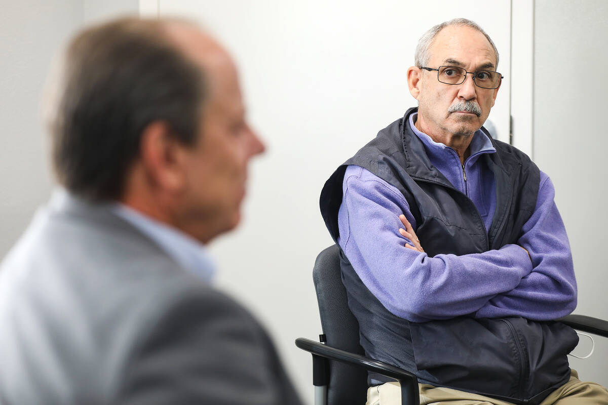 John Vellardita, Clark County Education Association executive director, listens to Tom Zumtobel ...