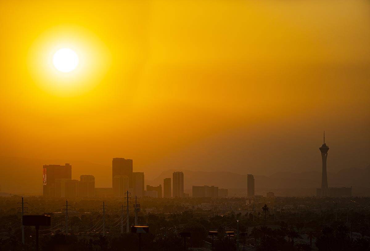 The sun shines through smoke and haze over the north end of the Las Vegas Strip on Monday, Sept ...