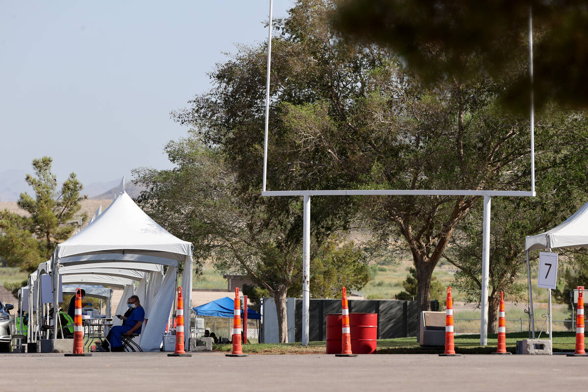 Workers prepare for testing at the COVID-19 testing site at Sam Boyd Stadium in August 2020. (K ...