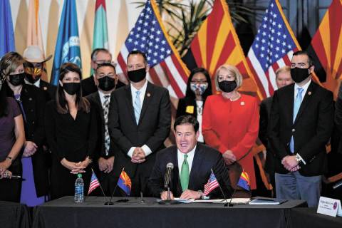 Republican Arizona Gov. Doug Ducey speaks at a bill signing allowing a major expansion of sport ...