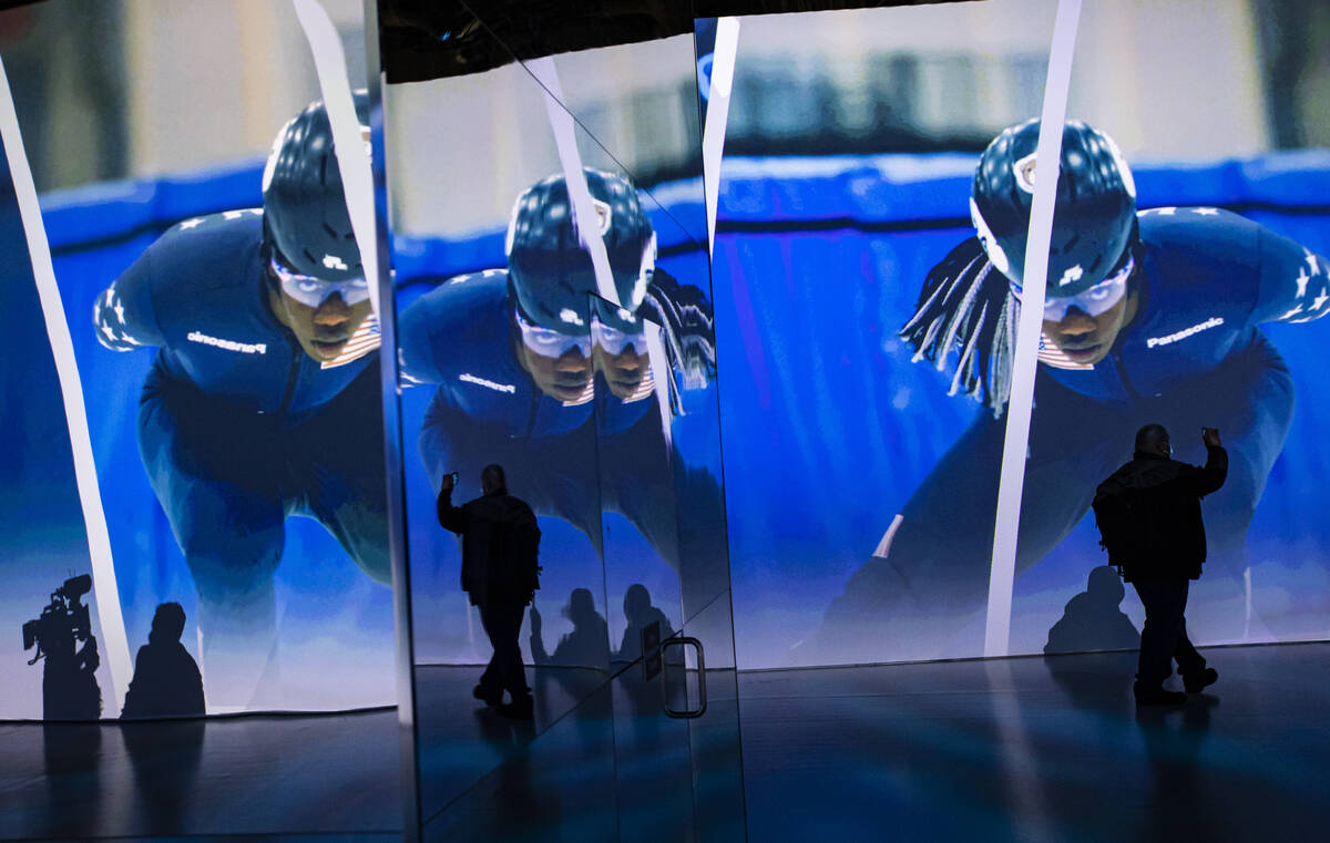 Attendees explore an immersive theater at the Panasonic booth during CES at the Las Vegas Conve ...