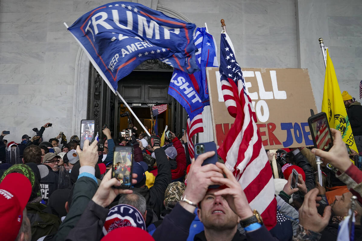 Insurrections loyal to President Donald Trump riot outside the Capitol, Jan. 6, 2021, in Washin ...