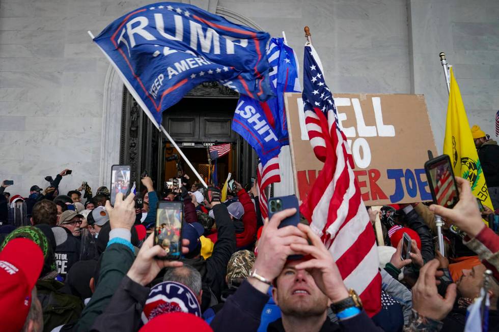 Insurrections loyal to President Donald Trump riot outside the Capitol, Jan. 6, 2021, in Washin ...