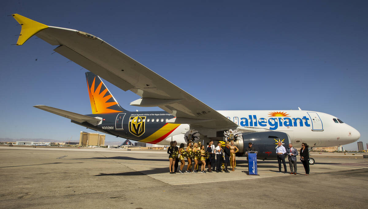 Dignitaries and team members gather as Allegiant unveils a new Golden Knights-themed plane at M ...