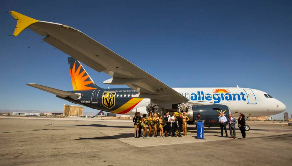 Dignitaries and team members gather as Allegiant unveils a new Golden Knights-themed plane at M ...