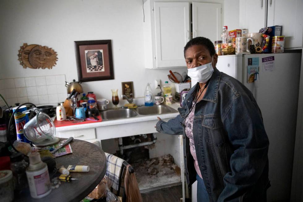 Brenda Abrams, 69, shows the torn apart sink in her unit at Desert Plaza Apartments on Tuesday, ...