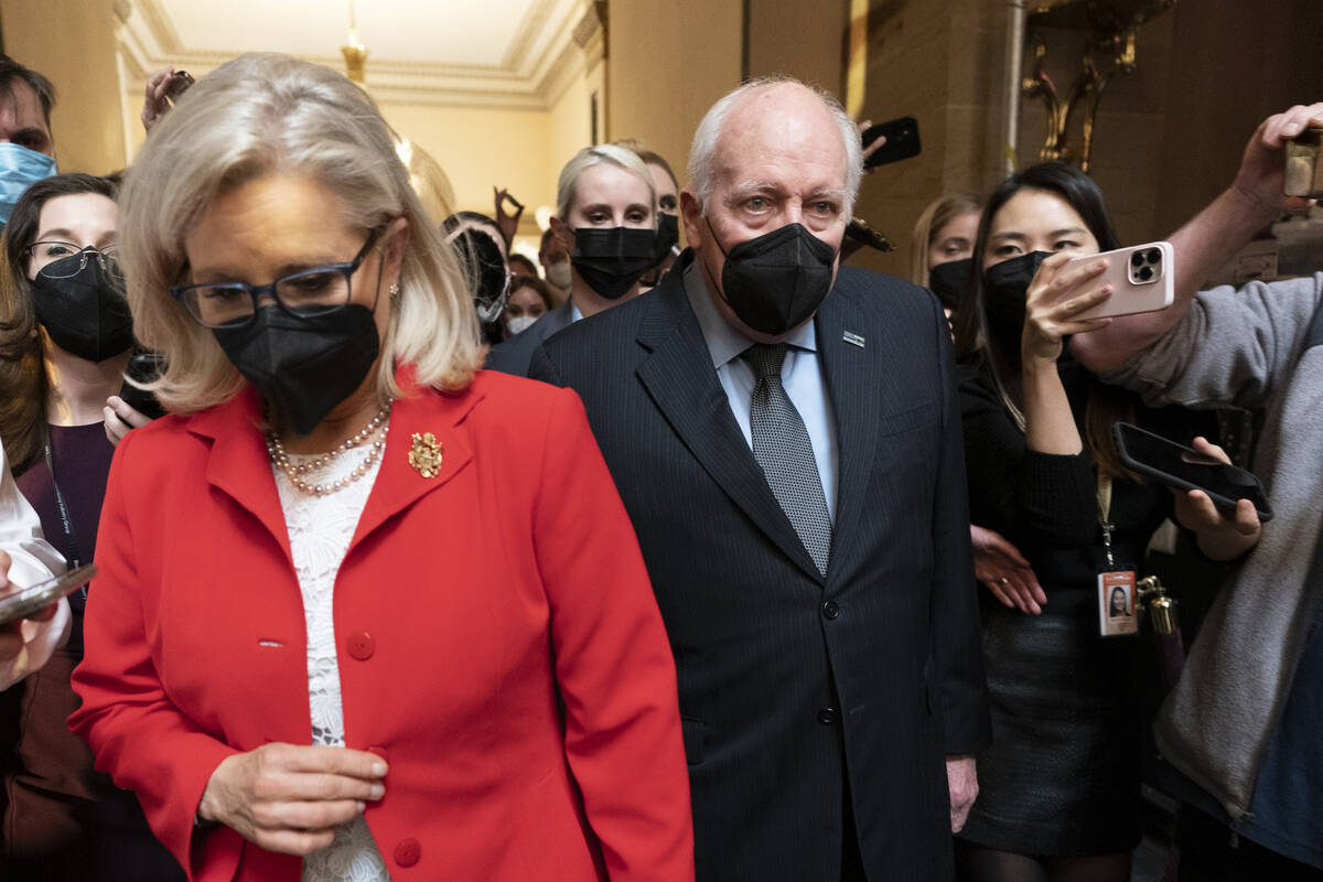 Former Vice President Dick Cheney walks with his daughter Rep. Liz Cheney, R-Wyo., vice chair o ...