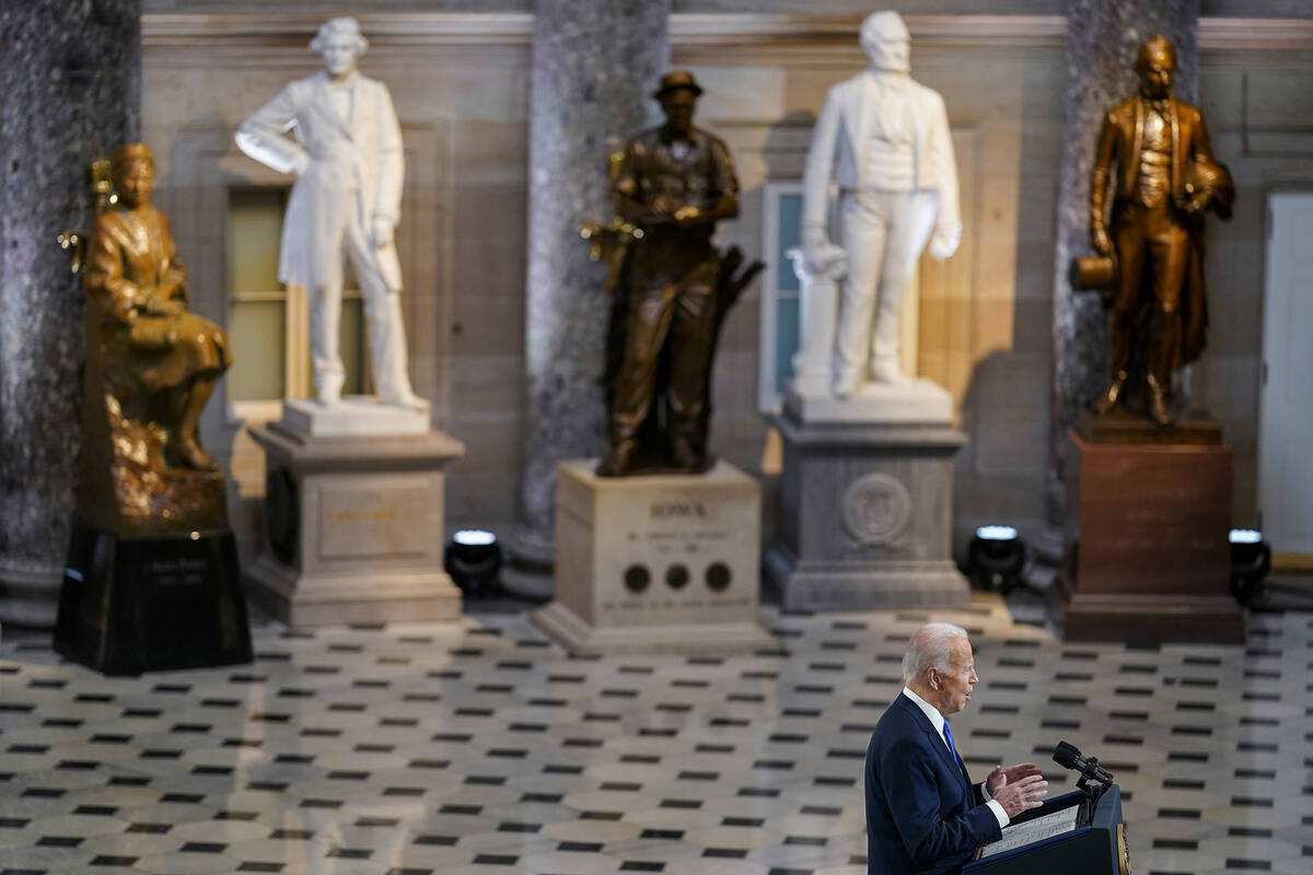 President Joe Biden speaks from Statuary Hall at the U.S. Capitol to mark the one year annivers ...