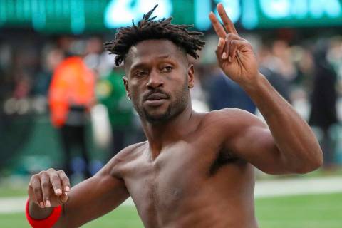 Tampa Bay Buccaneers wide receiver Antonio Brown (81) gestures to the crowd as he leaves the fi ...