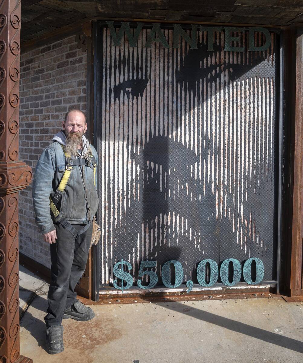 Richard Stephens/Special to the Pahrump Valley Times Artist James Henninger poses with his self ...