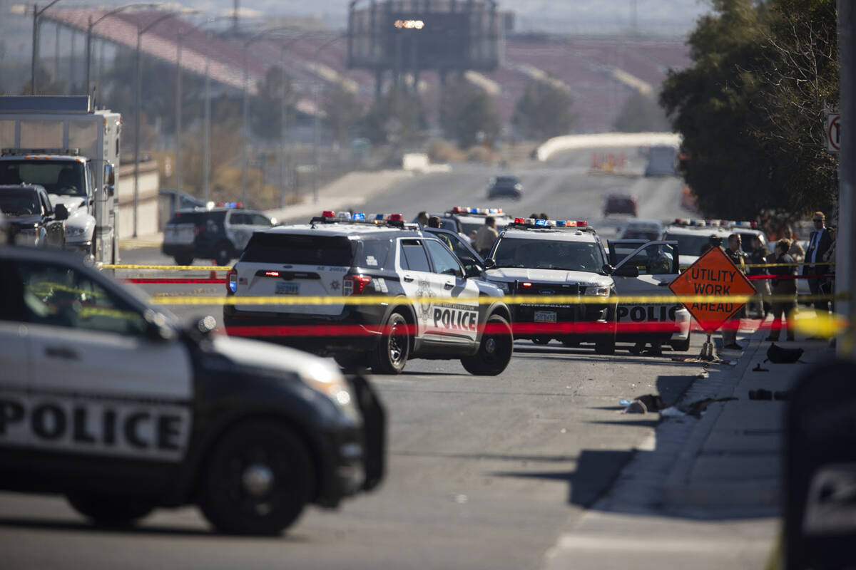 Las Vegas police investigate the scene of an officer involved shooting near the intersection o ...