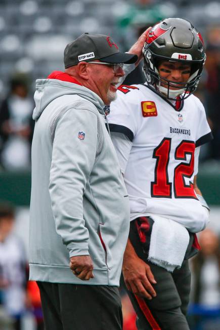 Tampa Bay Buccaneers head coach Bruce Arians, left, talks with quarterback Tom Brady before an ...